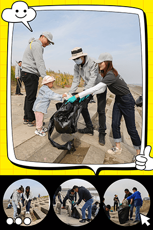 image of employees cleaning up beach